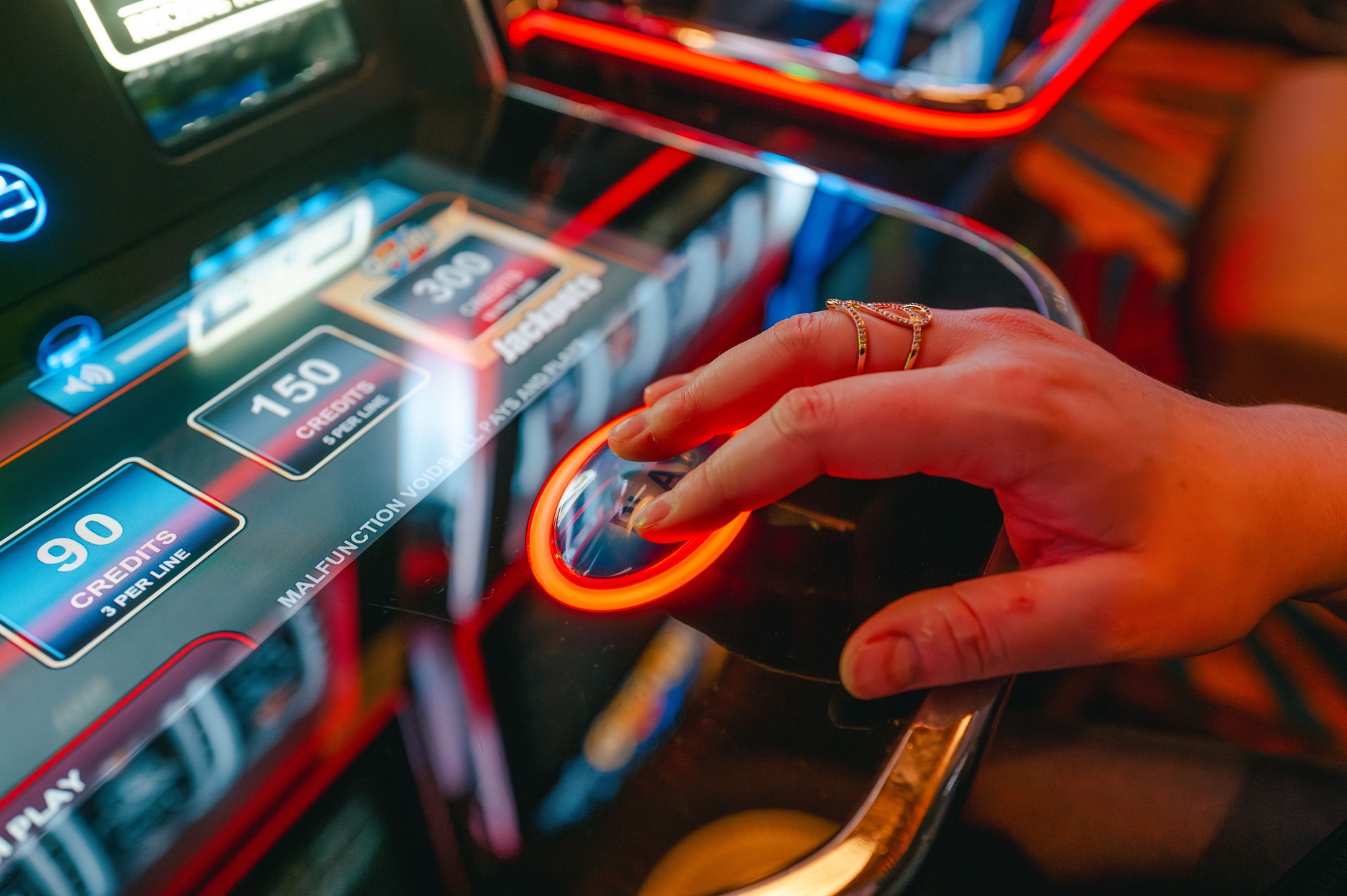 Casino Slot Machine - Play Button - Close Up - Hand